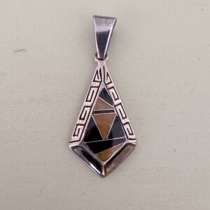 Calvin Begay Navajo jewelry designer pendant. 1 3/4 inches. Like new.
